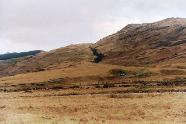 Hardknott Pass road from Wrynose Bottom.  OK, I know it is difficult to see, but believe me, it is there, zig zagging its way up the hill, to the left of the black area in the middle of the picture.