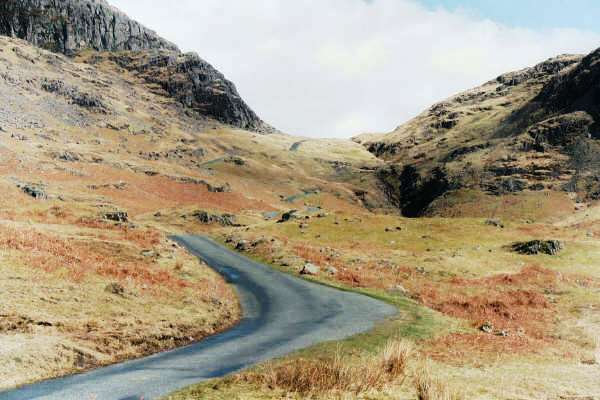 Hardknott Pass from Eskdale. You can just see the road make its way down from the saddle between the hills.